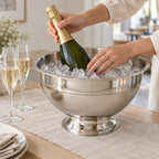 Skål på fod i stål med is og champagne